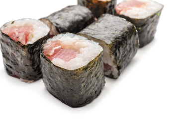 Tasty sushi rolls on white background