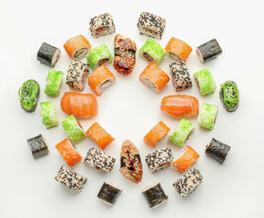 Composition with tasty sushi on white background