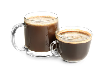 Glass cups with tasty aromatic coffee on white background