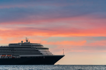 Fototapeta na wymiar Luxury cruise ship in the sea at sunset. with copy space for your text message or content