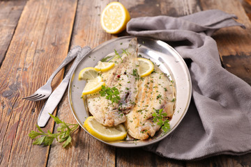 grilled fish with butter and parsley