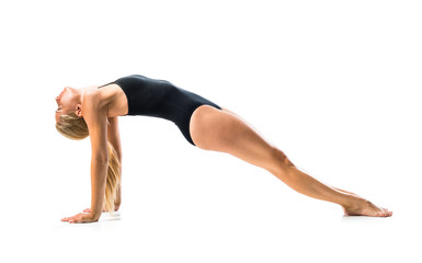 Young blonde woman in maillot practicing yoga lesson