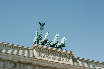 Naklejka premium Closeup of the Brandenburg Gate against the blue sky. This is one of the attractions of Berlin in Germany.