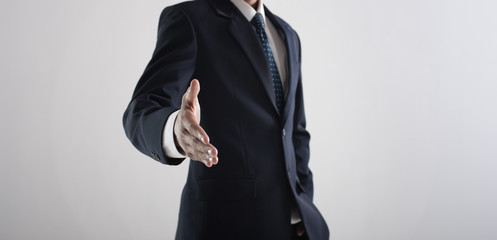 Businessman Showing handshake, welcoming you concept.