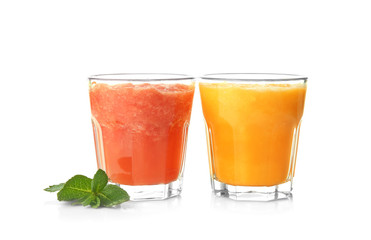 Glasses with tasty fruit smoothies on white background
