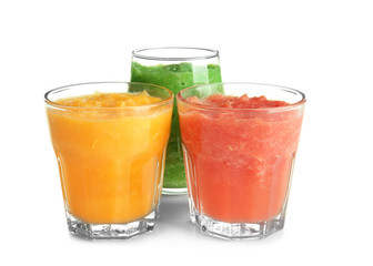 Glasses with tasty fruit smoothies on white background