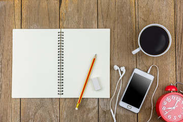 Computer top view on wooden background