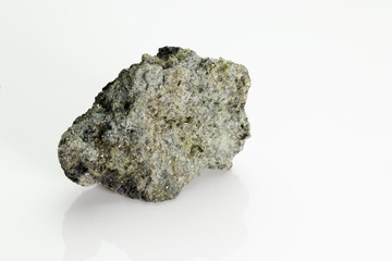 The olivine is a magnesium iron silicate mineral, from Vesuvius volcano, isolated on a white background, Naples, Italy