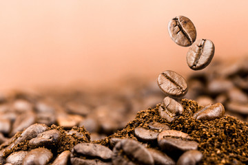 Coffee beans falling on pile