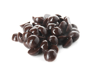 Delicious dark chocolate chips on white background