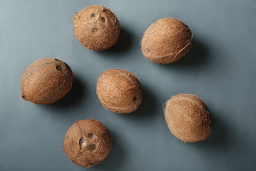 Ripe coconuts on grey background