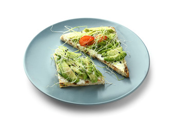 Plate with delicious avocado toasts on white background