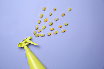 Creative composition with spray and grapes on color background