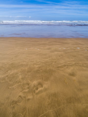 Fototapeta na wymiar Sandy beach on the coast in Essaouira, Morocco