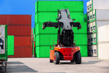 Forklift truck working in container warehouse for logistics shipping, import export or transportation.