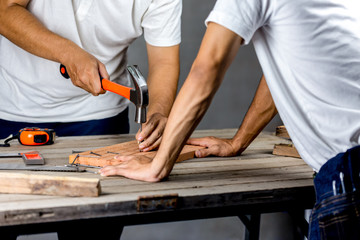 Carpenter man hammering a nail