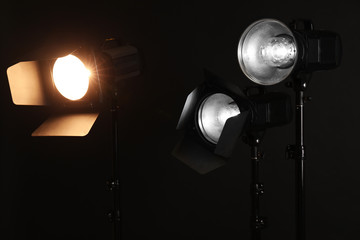 Professional lighting equipment on dark background