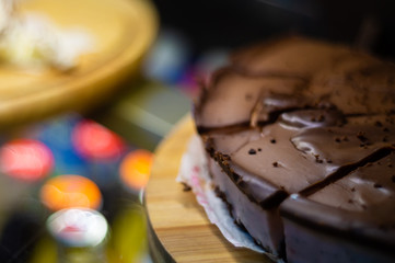 Obraz na płótnie Canvas Low light photo of chocolate cake in freezer