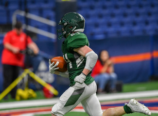 Great action shots of high school football player making amazing plays during a football game © Joe