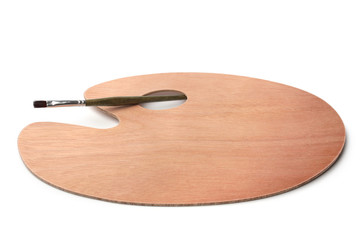 Empty wooden palette with paintbrush