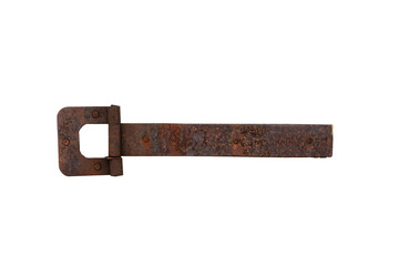 The rusty steel iron hinge was weathered by the gray door.