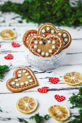 Gingerbread Cookies hearts in a cup on a white wooden background. Valentines day concept