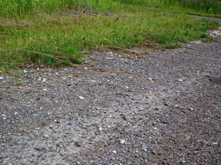 road in the village of small stones in the summer