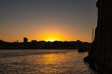 Naklejka premium view of the city of porto under the bridge dom luis at sunrise