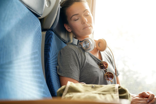 Young Woman Sleeping Peacefully On Train