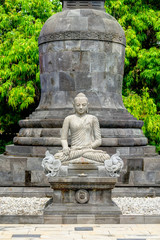 Fototapeta na wymiar Buddha statue in Candi Mendut Monastery near Borobudur. Central Java, Indonesia