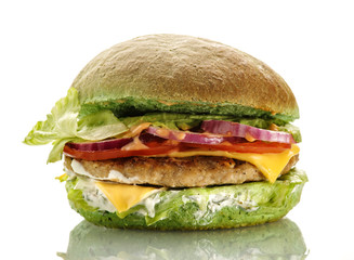 Fresh homemade delicious burger with a spinach bun. Isolated on white.