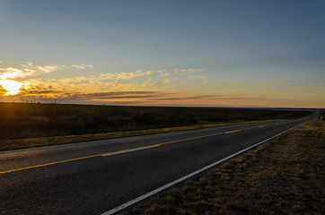 Fototapeta na wymiar Route landscape on sunset in plane geography