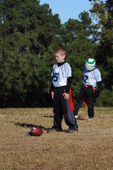 Fototapeta premium Boy Plays Quarterback in Flag Flootball