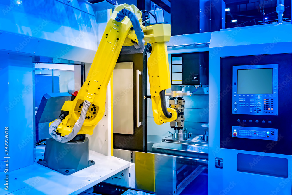 Poster robot in production. robotic arm. a computer program manages the processes. factory manipulator. pro