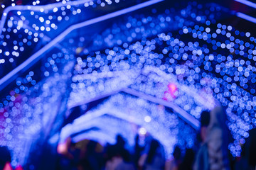 BLUE Bokeh of a street with people on christmas day or New year