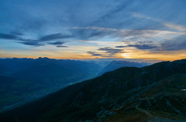 Obraz na płótnie Canvas Sunrise from the top of Helm (M. Elmo - 2,434m) down the Pustertal into Austria - Sexten Dolomites, Italy