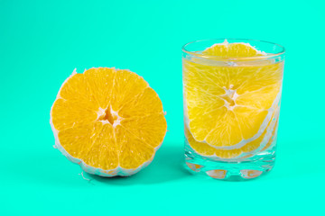 Fototapeta na wymiar lemonade in a clear glass, orange slices