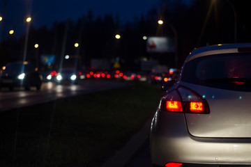 Fototapeta na wymiar traffic jam at night in a big city. Blurred Background