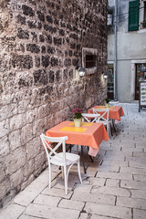 Empty tables at a street restaurant