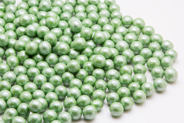 Multi-colored pearls on a white background