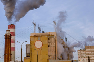Nuclear power plant discharges steam into the atmosphere, cooling its reactors.