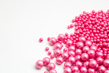 Multi-colored pearls on a white background