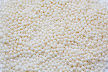Multi-colored pearls on a white background
