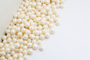 Multi-colored pearls on a white background