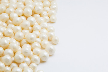 Multi-colored pearls on a white background