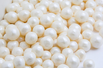 Multi-colored pearls on a white background