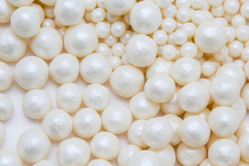 Multi-colored pearls on a white background