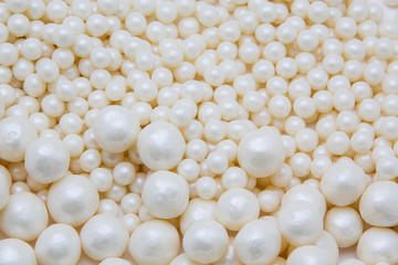 Multi-colored pearls on a white background