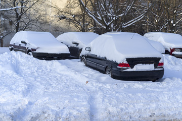 Snow covered cars in the winter