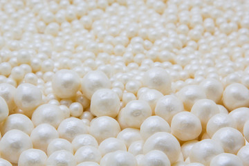 Multi-colored pearls on a white background